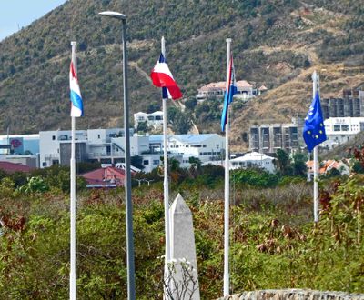 4 flags of St. Maarten at Dutch Border