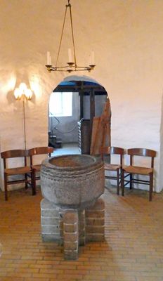 The Roman baptismal font in the center pillar of Osterlars Church dates to the 12th century
