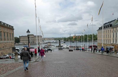 Walking down Slottsbacken (Castle Slope) leading from Stockholm Cathedral to the waterfront of Old Town