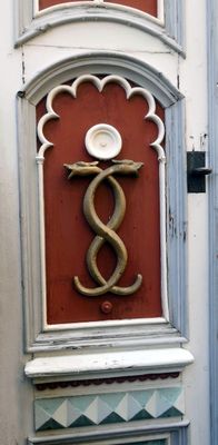 Medieval mediacl symbol on the door of the Old Town Pharmacy in Tallinn, Estonia