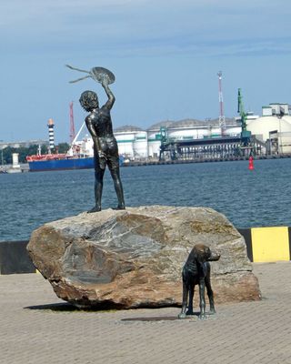 Statue of a boy and his dog bidding farewell to ships leaving Klaipeda, Lithuania