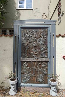 Bronze door showing important occupations in medieval Klaipeda, Lithuania