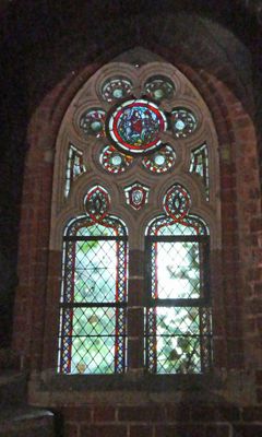 Stained glass in small, dark room in Malbork Castle