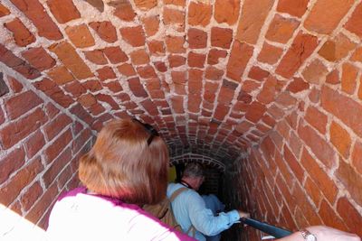 Exiting Malbork Castle in small, steep, low staircase