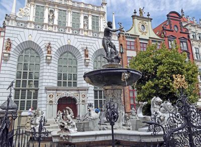 Neptune's Fountain (1633)stands in front of Artus Court (1350) on the Royal Route in Gdansk