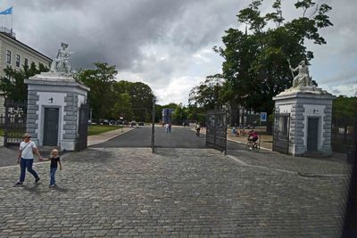 The old Freeport gate in Copenhagen with guard houses topped by zinc statues of Neptune and Mercury