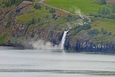 Hot Spring flowing into the colder water of the Eyja Fjord in Iceland