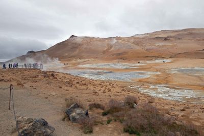 Námafjall Geothermal Area in Iceland has many smoking fumaroles and boiling mud pots
