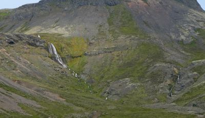 Passing a small waterfall in Iceland