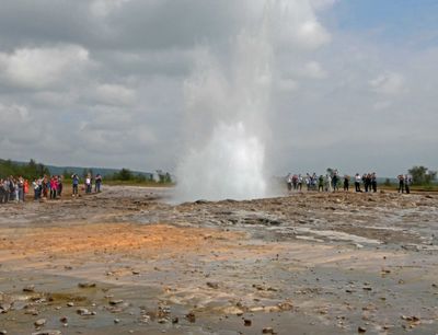 Crowds waiting for Strokkur geyser to erupt in Geysir Geothermal Area, Iceland