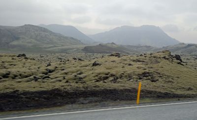 Haze over old lava field and valley from Fagradalsfjall volcano which began erupting 11 days ago
