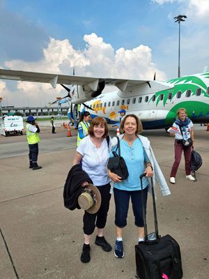 Two Susans ready to board twin-prop plane to Cambodia