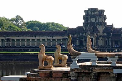 Statues on the causeway to Angkor Wat Temple in Cambodia