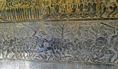 Bas-relief in Angkor Wat with Heaven above and Hell below