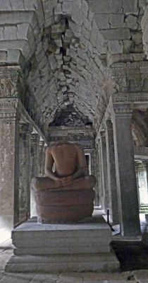 800-year old headless buddha at Ta Prohm Temple in Cambodia