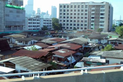 Older neighborhoods still exist among newer buildings across Bangkok