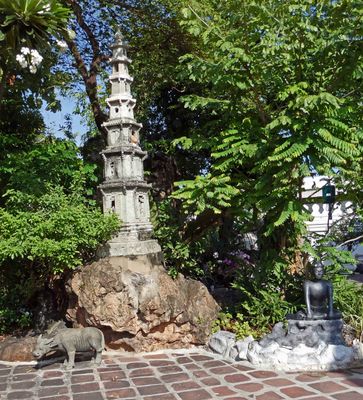 Miniature Pagoda and Water Buffalo statue on the grounds of Wat Pho temple complex
