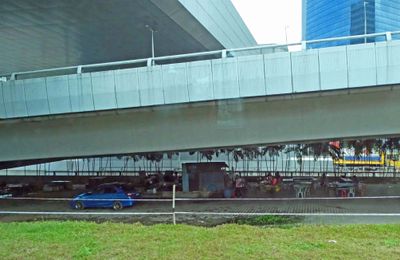 Outdoor restaurant under a bridge in Kuala Lumpur, Malasia