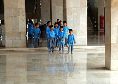 Young boys learning the proper way to circumnavigate the Kaaba