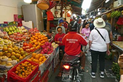 Motorbikes mixing with pedestrians in Jakarta's Chinatown Market