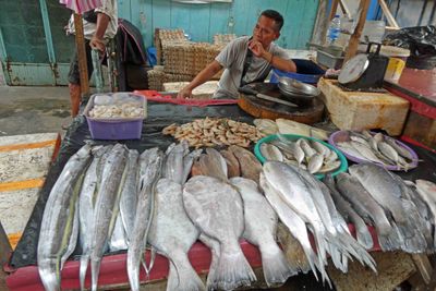 Fish seller at Jakarta's Chinatown Market