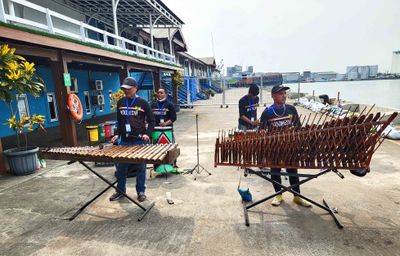 Indonesian musicians on the pier at the port of Sanjung Emas Semarang, Indonesia