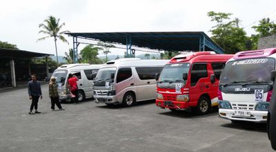 Transferring from 44-passenger bus to 8-passenger vans to continue in Central Java