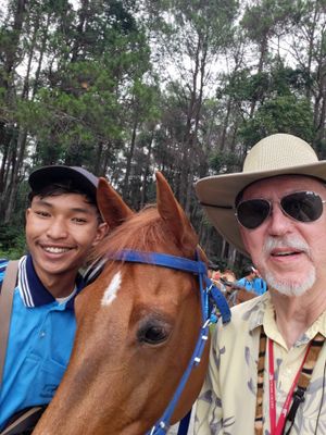 Bill with his horse and handler gearing up to head down the trail