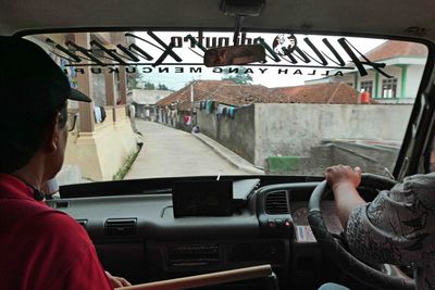 Traveling on a narrow street in Ungaran, Indonesia