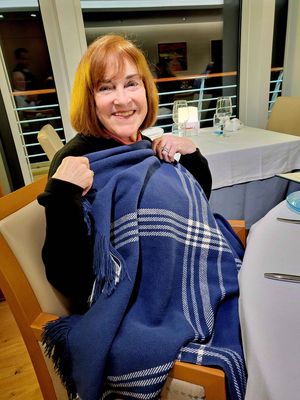 Susan was cold in dining room so the waiter brought a blanket