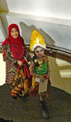 Young Indonesian girl and mother visiting the 10 November Museum