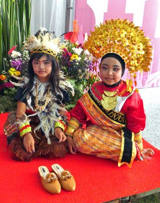 Young girls participating in exhibition of Indonesian dress