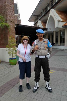 Susan with Indonesian Police Officer at the Birth of Blessed Virgin Mary Church in Surabaya, Indonesia