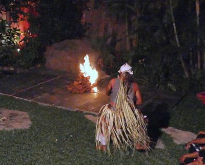 Kecak Fire Dancer rides a horse made of coconut leaves