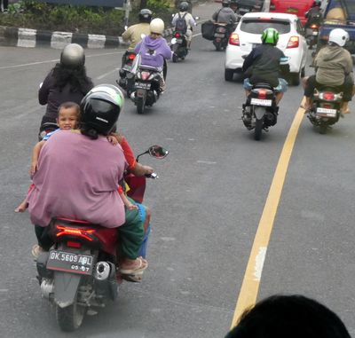 Family on a motorbike in Bali