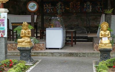 Statues at entrance to ice cream shop at Ulun Danu Beratan