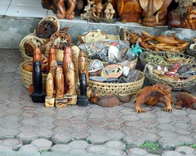 Hand-carved souvenirs on the walk to Tanah Lot temple in Bali