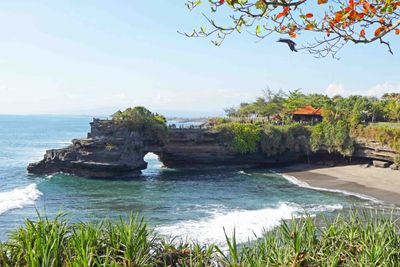 Batu Bolong Temple (16th Century) is a sacred site and can be seen from Tanah Lot