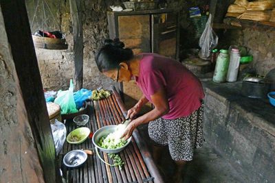 Preparing lunch in traditional Balinese kitchen