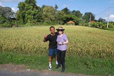 Damar and Susan in front of rice patty