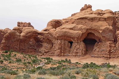 Looking at hikers on Double Arch Trail