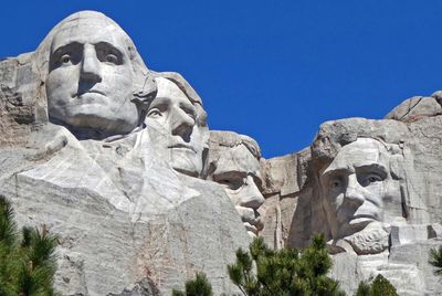 Washington's sculpture is the only one that includes any detail below chin level