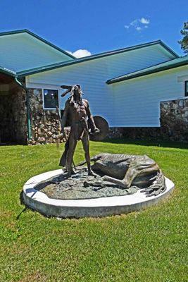 Death Song sculpture stands in front of the entrance to Crazy Horse Memorial