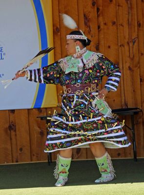 Lakota Indian demonstrates traditional Lakota costume and dance