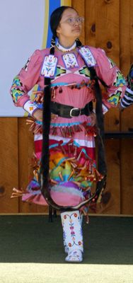Young Lakota demonstrates a traditional Lakota costume and dance