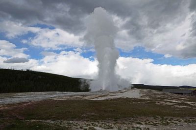 Old Faithful late afternoon eruption in Yellowstone National Park