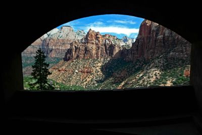 View from window carved in the side of the natural rock tunnel in Zion National Park