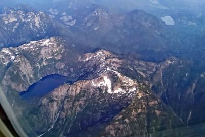 Flying over mountain lake near Canadian Border