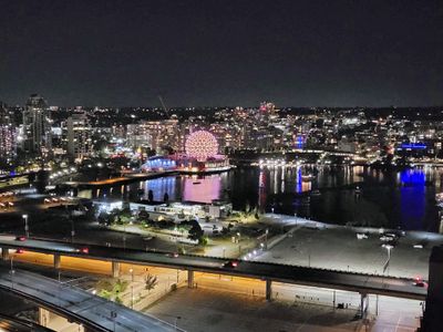Nighttime view of Vancouver Science World at the end of False Creek
