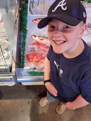 William with fish at Grantville Island Public Market